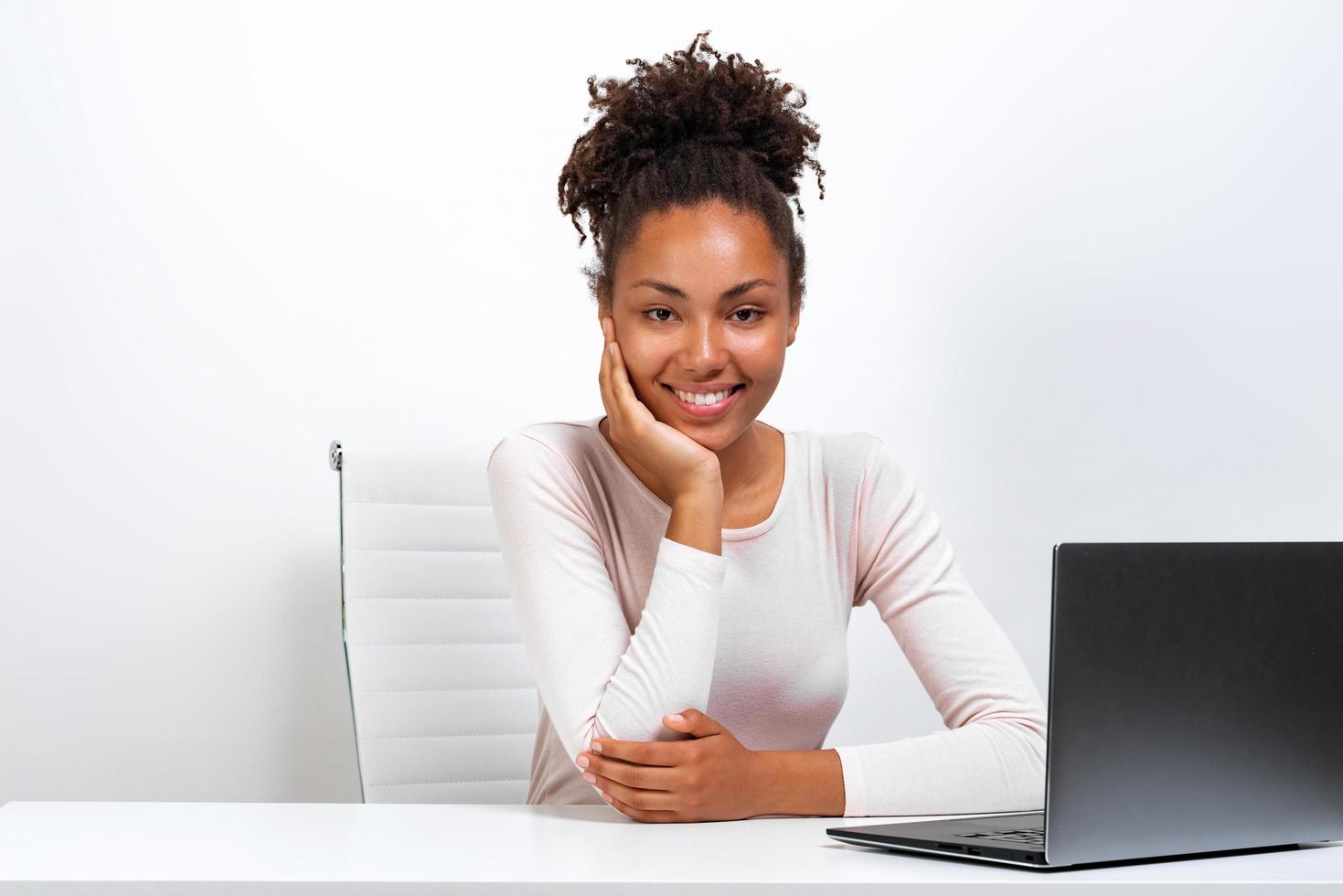 Cheerful girl have a rest sitting in the office photo