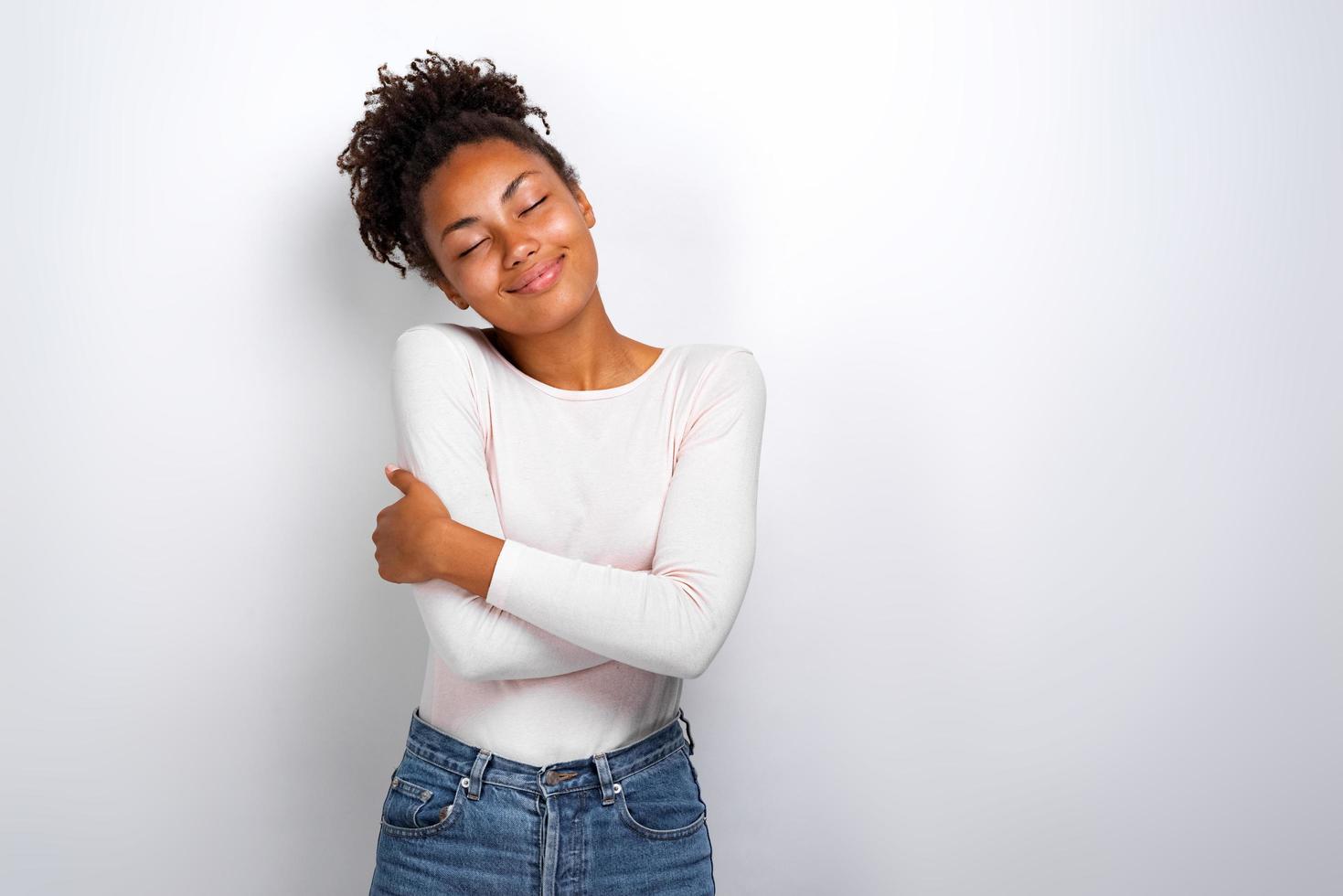 Charming Woman Hugging Herself Feeling Comfort And Calmness Image Stock Photo At Vecteezy