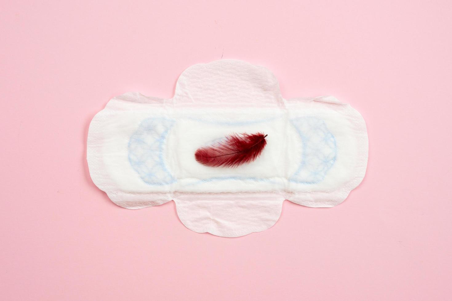 Women's health concept photo, some aspects of women's wellness in monthlies period. Menstrual pad. photo