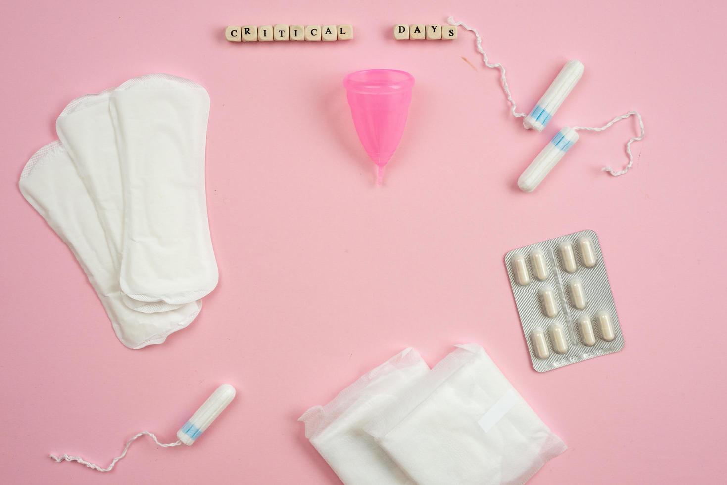 Remedies for critical days on a pink background. photo