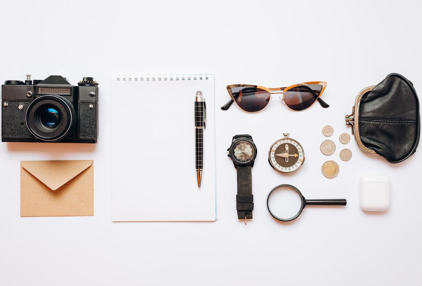 On a white background are laid out things for travel, the concept of planning and preparation photo