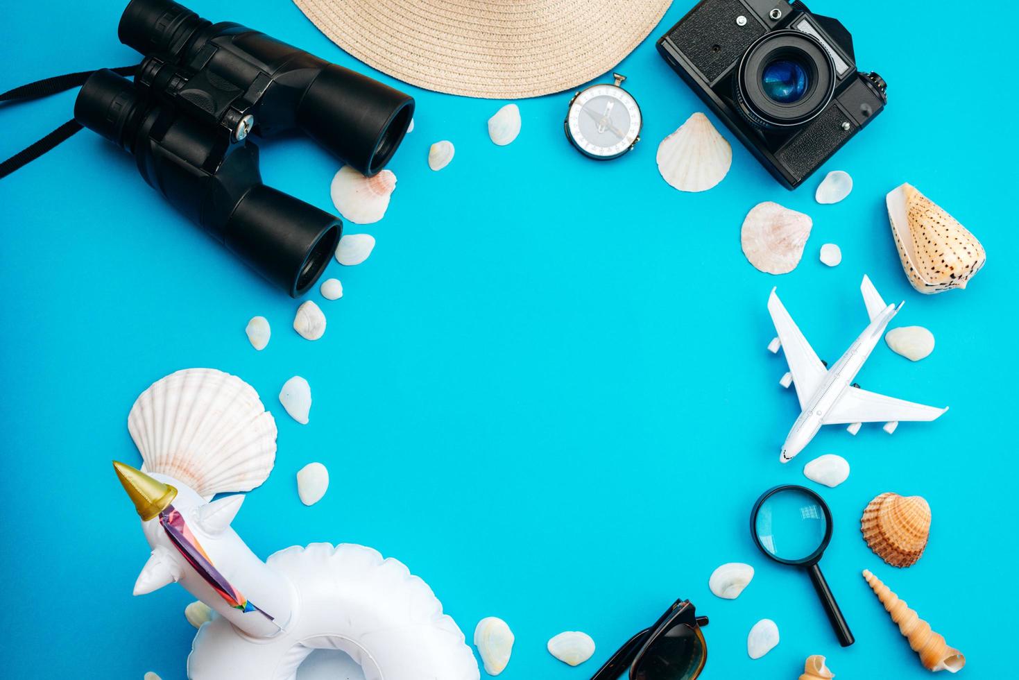 Summer holiday background, travel concept with camera on blue background , top view photo