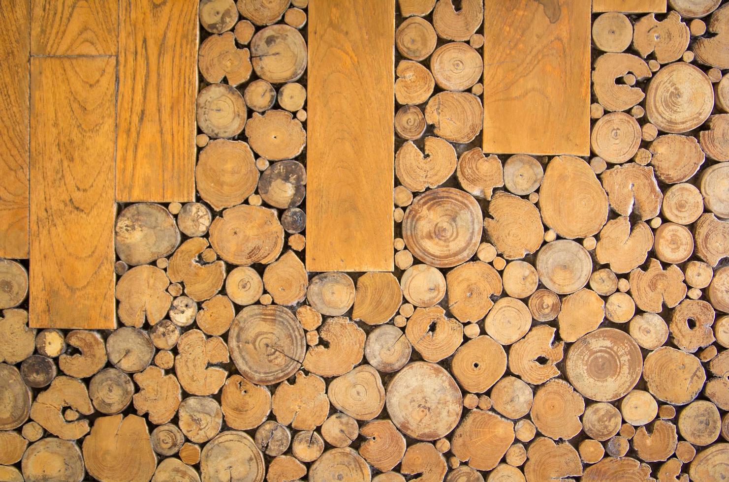 Wall of stacked wood logs for background photo