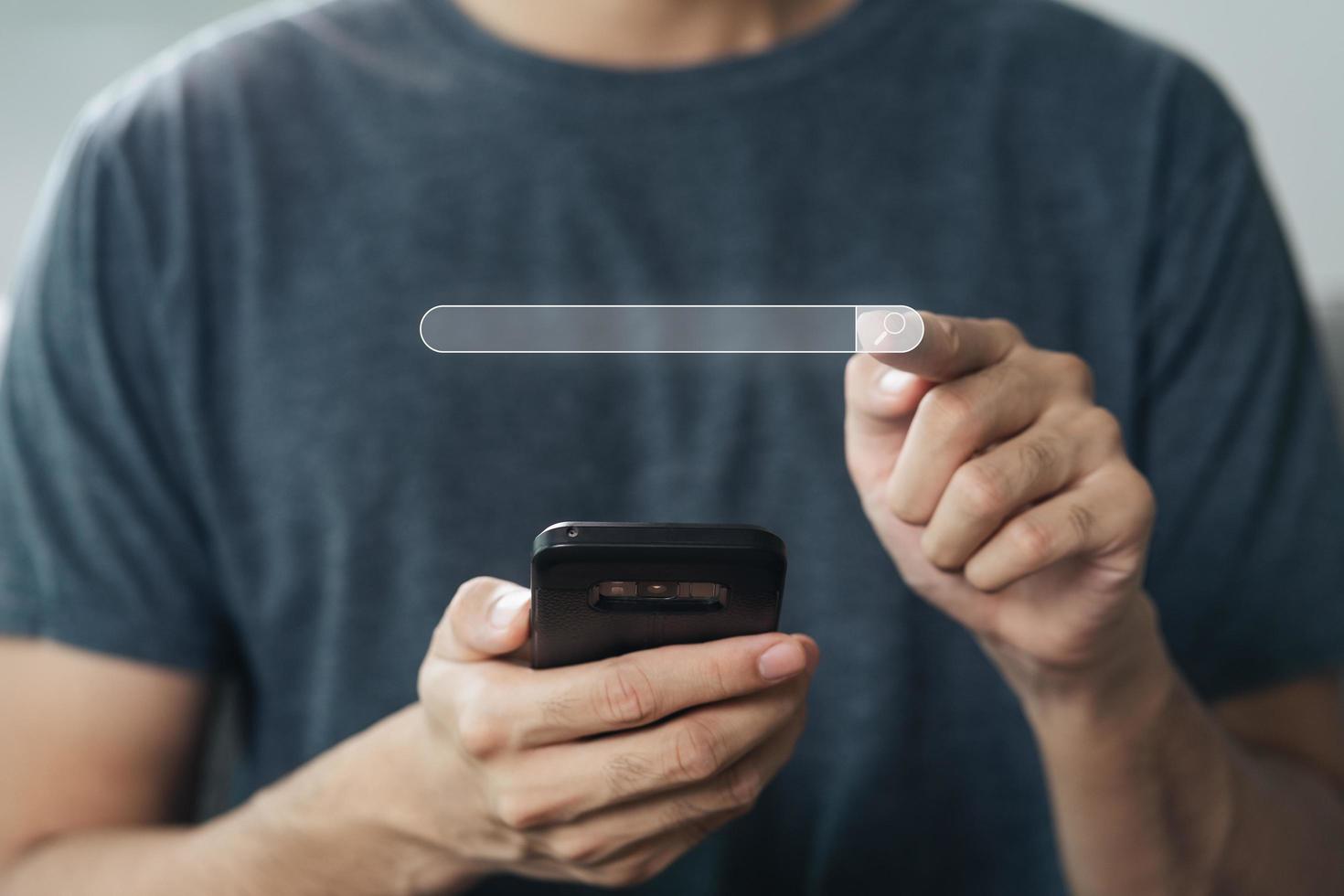 Man using a smartphone to Searching for information with the Search bar, Web browser, Data Search, Search Engine, Technology Concept photo