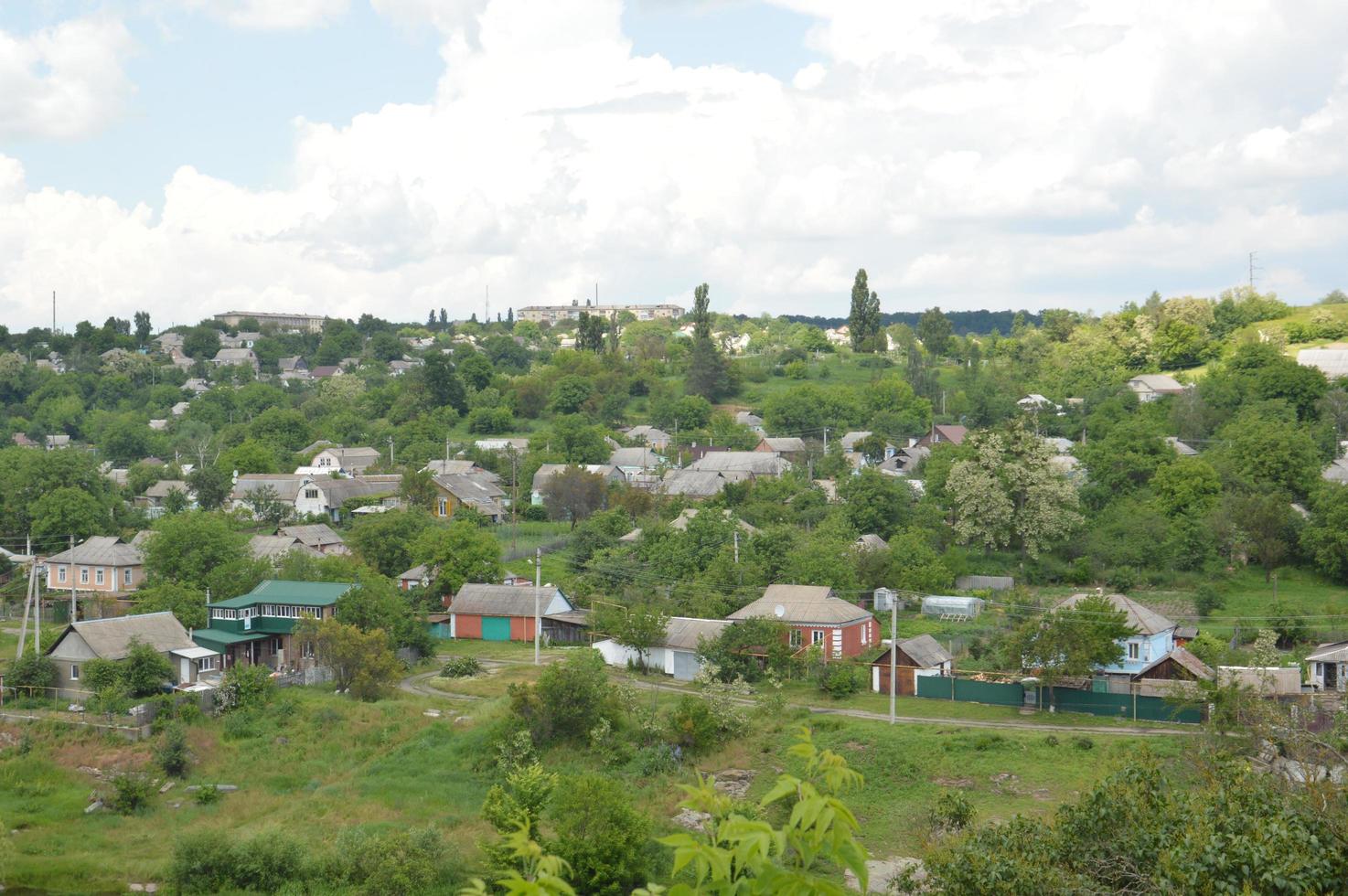 Small town panorama with river and houses photo