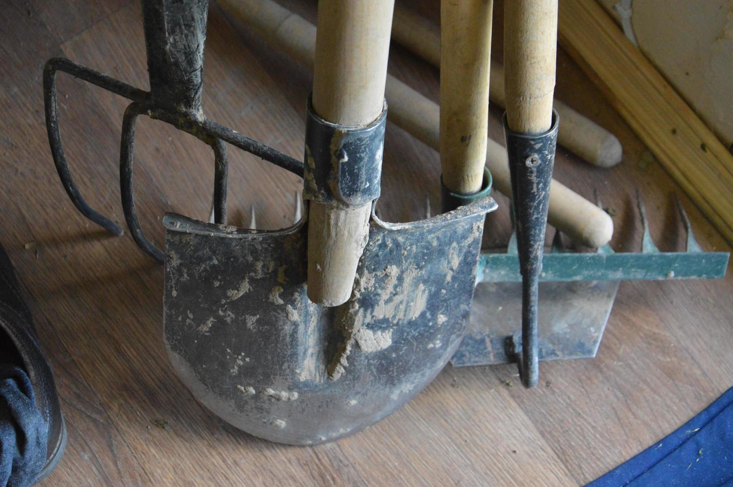 Various garden tools for caring for a vegetable garden in the village photo