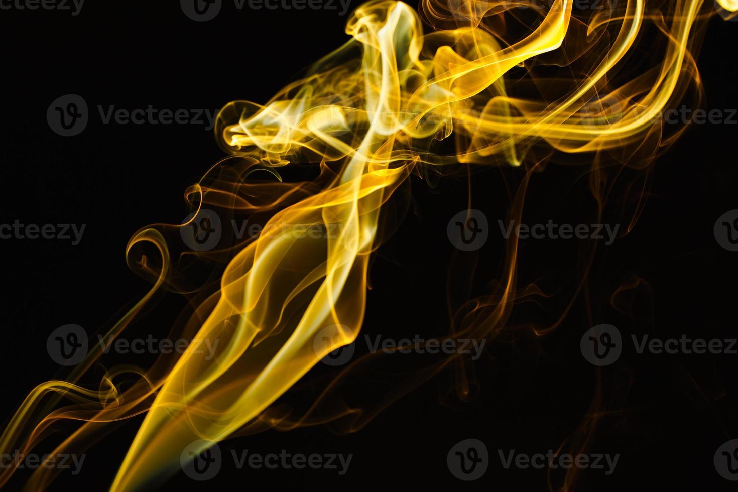 Smoke floating on dark background photo