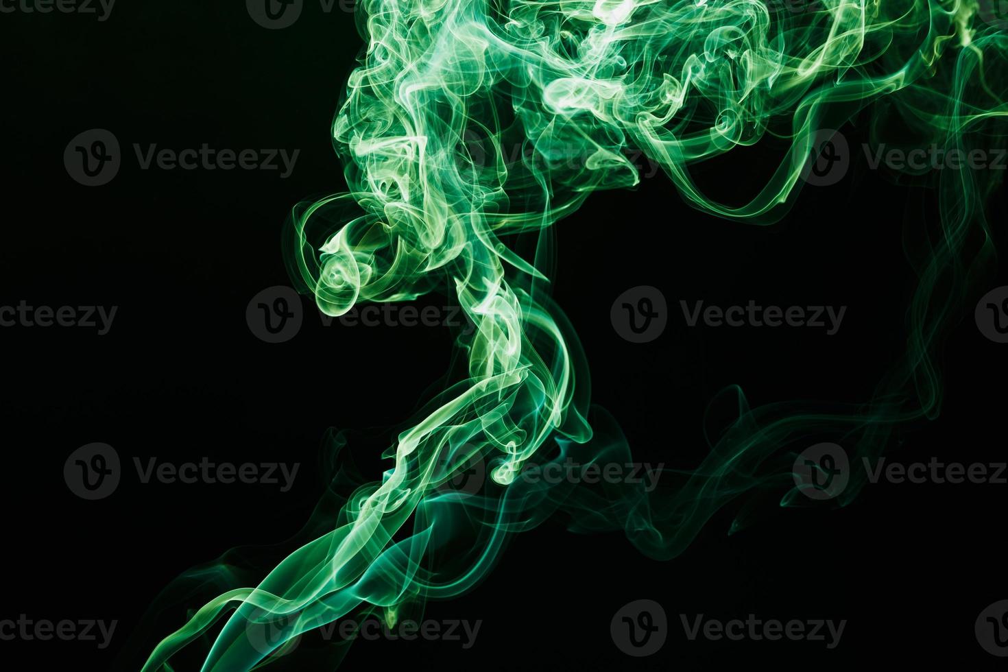 Smoke floating on dark background photo