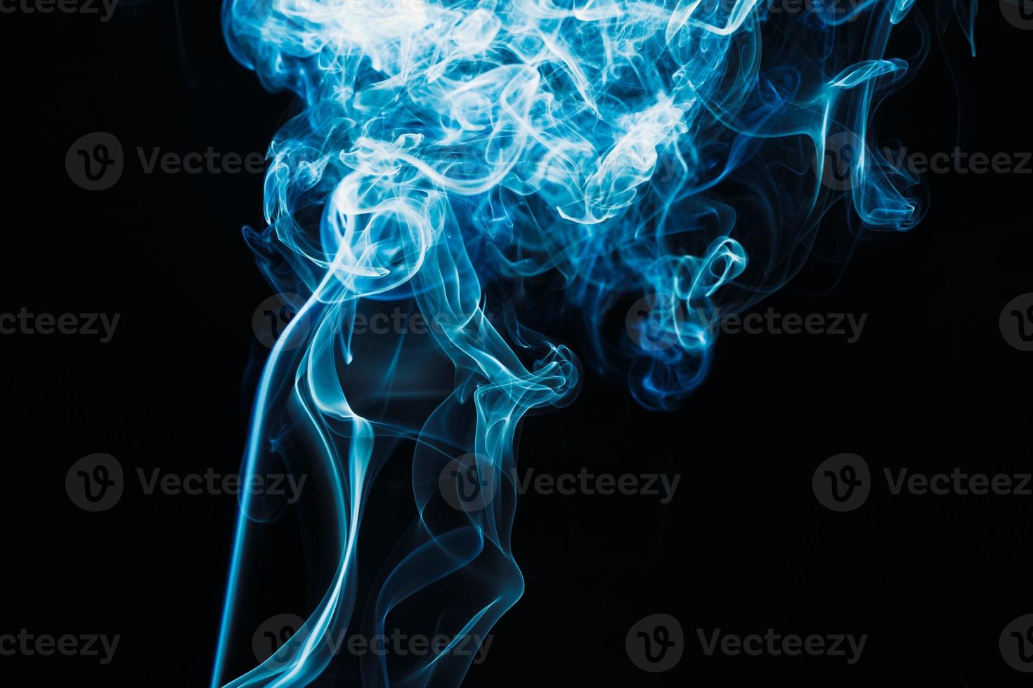 Smoke floating on dark background photo