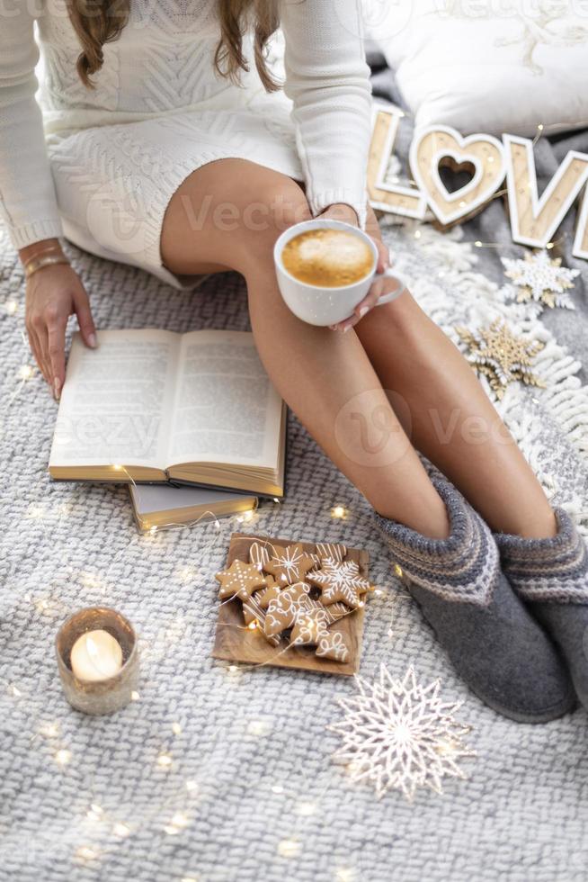 Cozy woman legs with christmas socks. photo