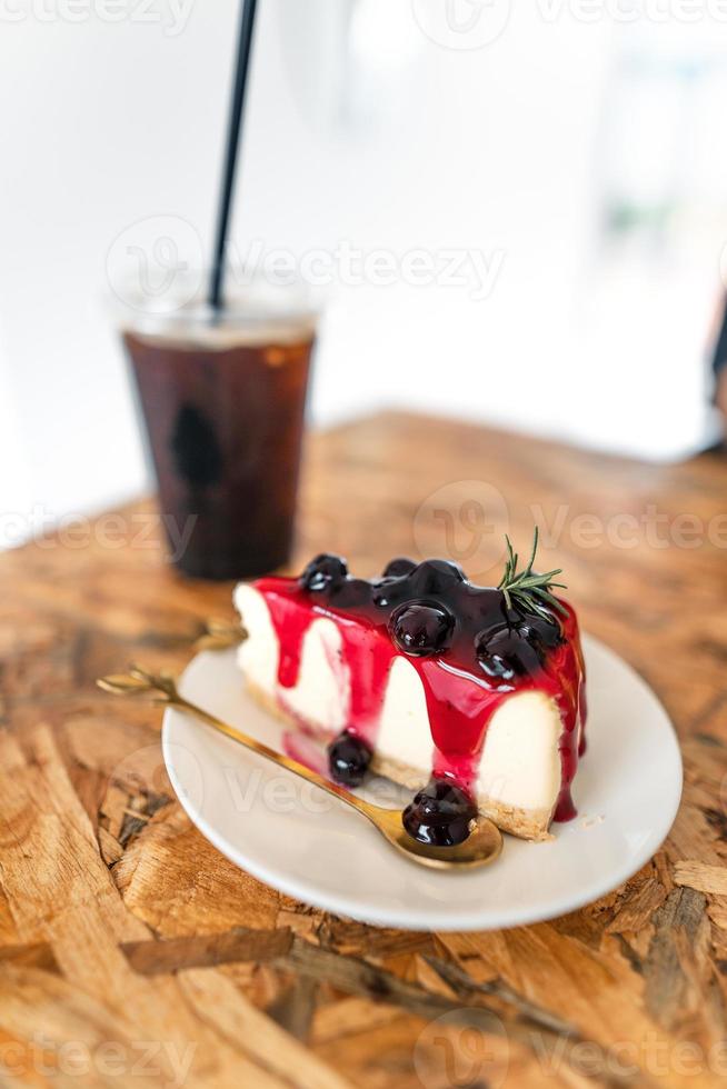 Blueberry cake on a plate in a cafe photo