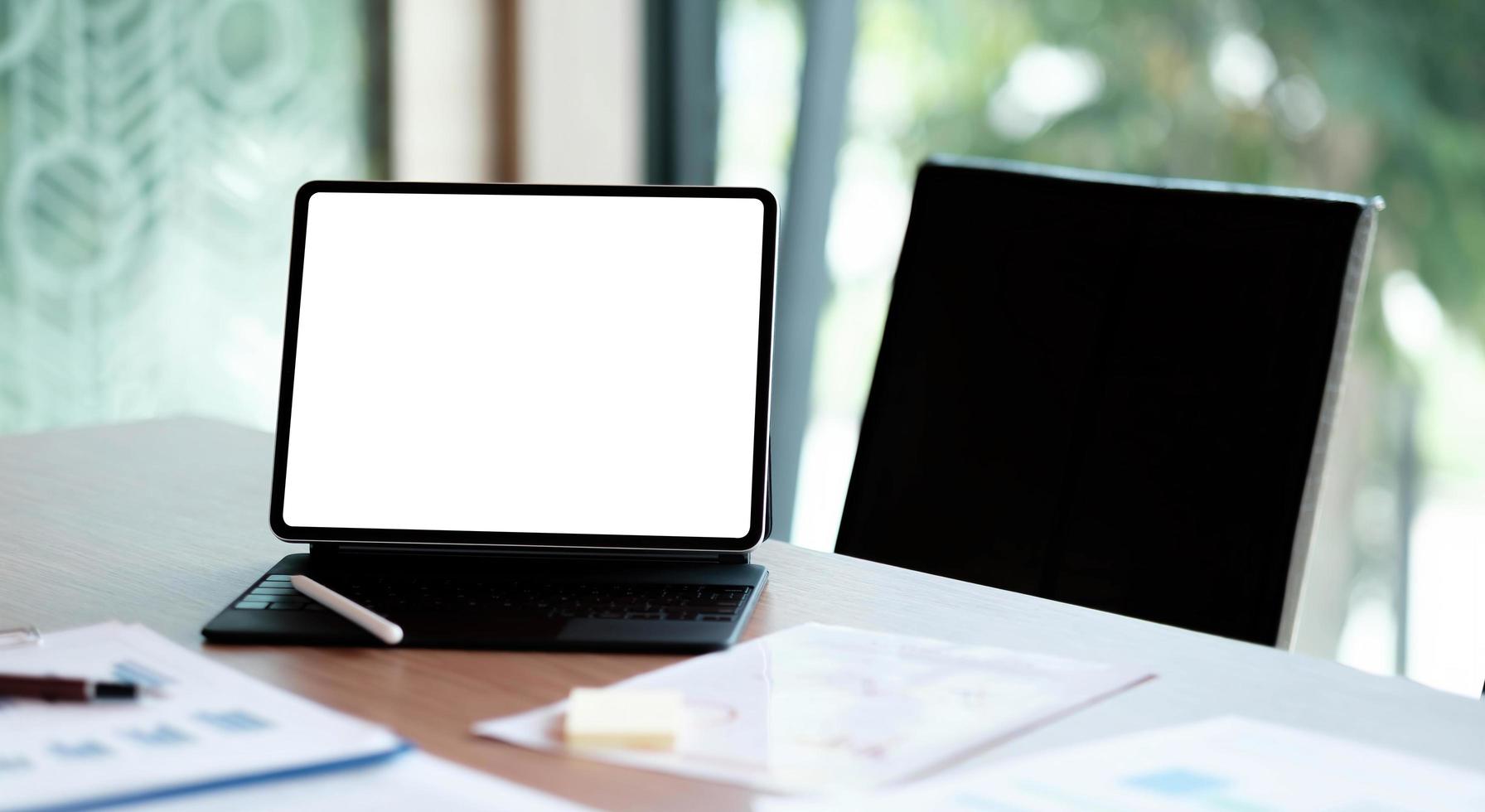 Desk Laptop with blank screen on table of coffee photo