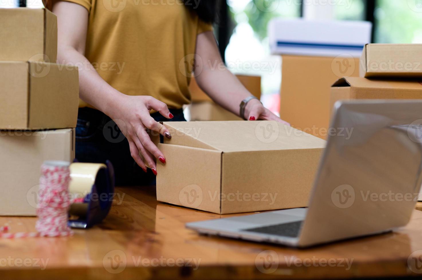 Online sellers are packing boxes for shipping, Online shopping, Shipping parcels. photo