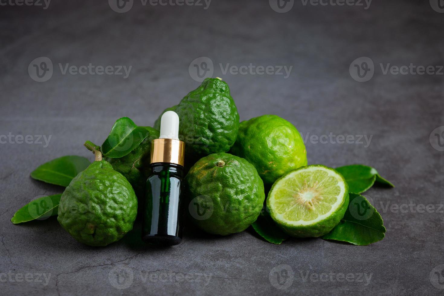 Bergamot oil on black background photo