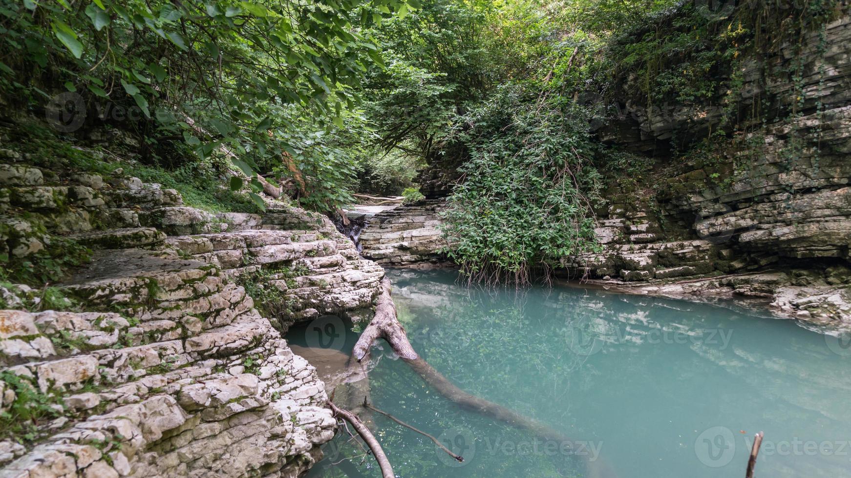 Beautiful forest and mountain river in Psakho canyon, Krasnodar Krai, Russia. photo