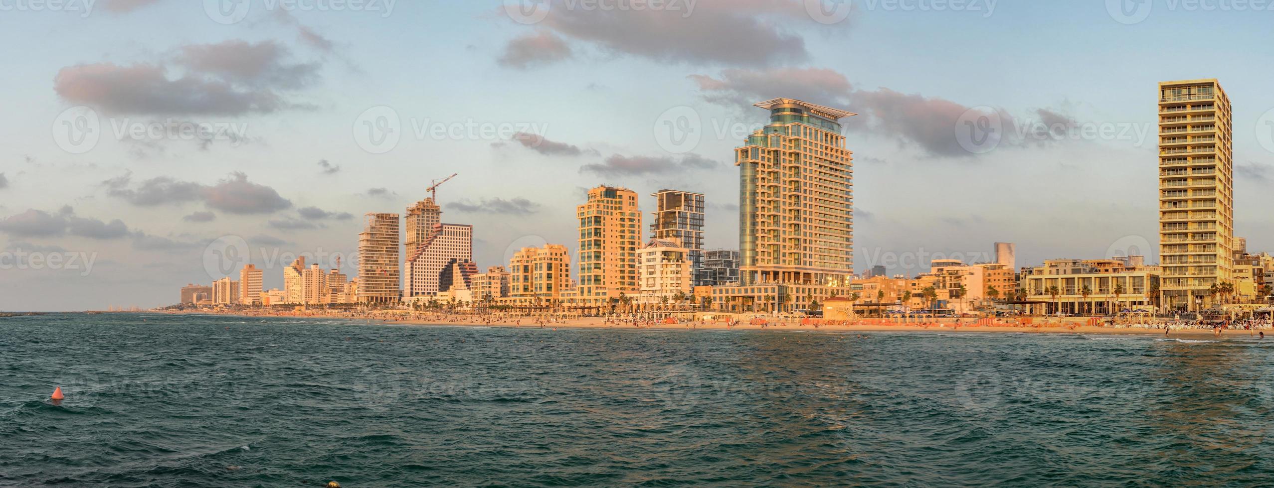 Panoramic view of Tel Aviv from the Mediterranean Sea at evening. photo