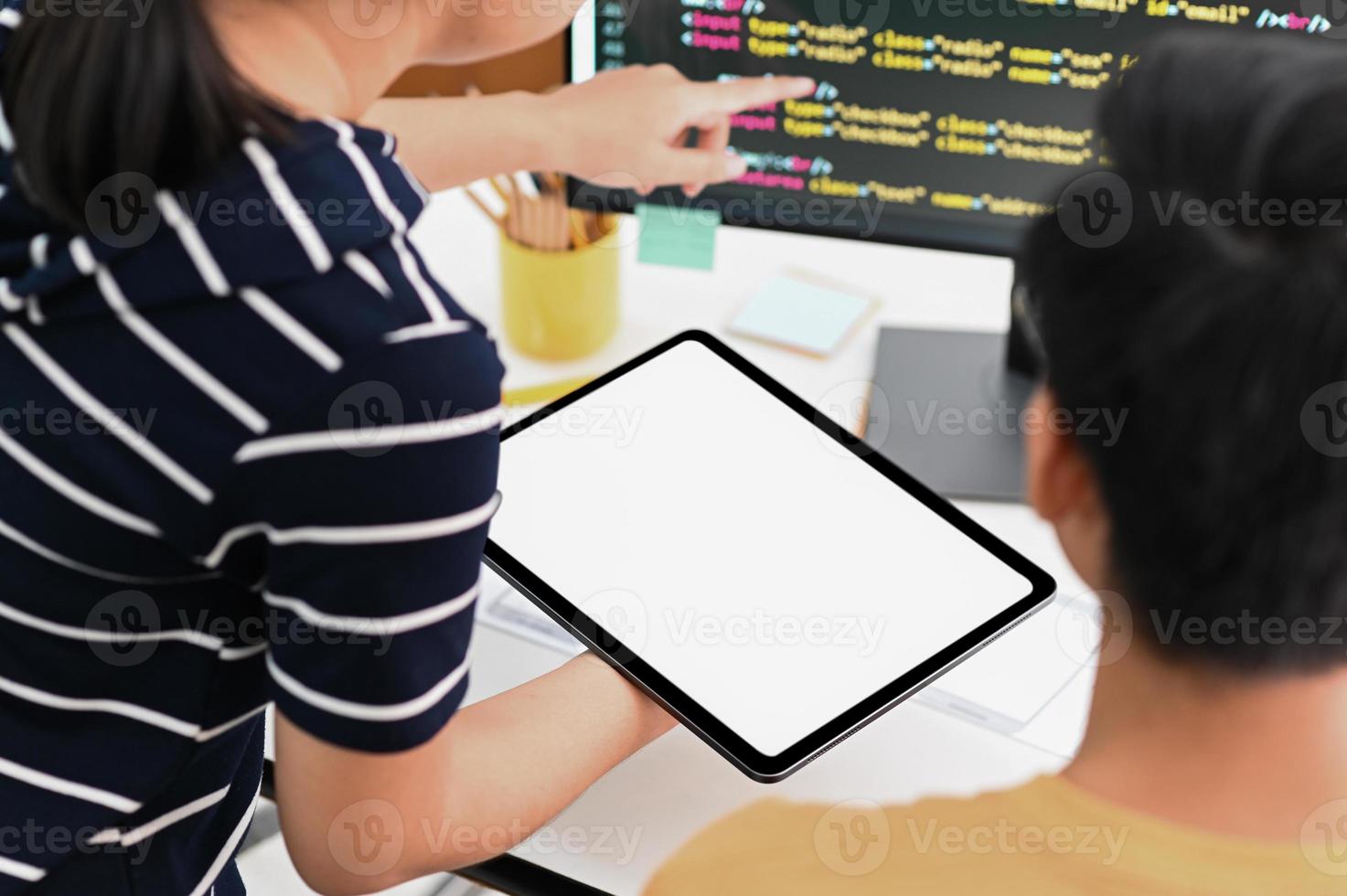 Team of programmers with tablet and computer is programming to present customers. photo