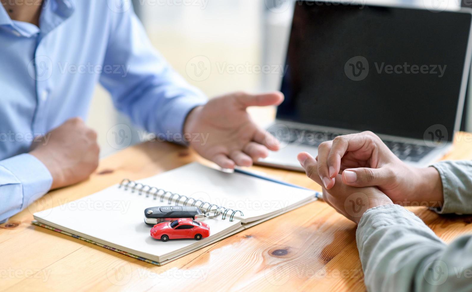 Finance staff are recommending car loans for customers. photo