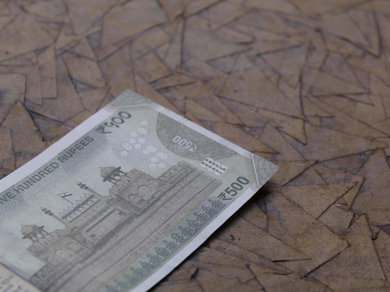 Indian banknote of 500 rupees on the brown surface photo