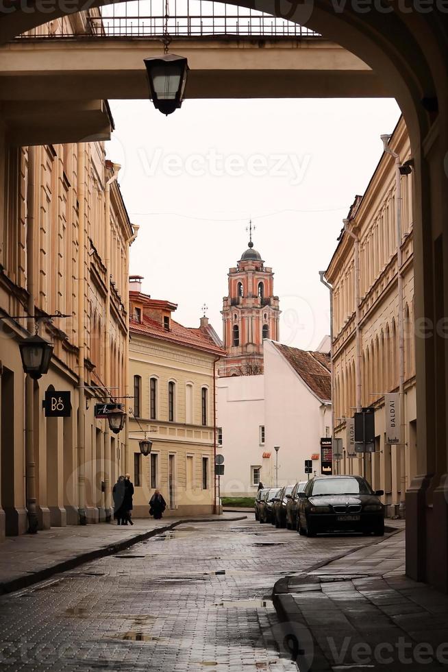 Philarmonic building with big street arch and street light photo