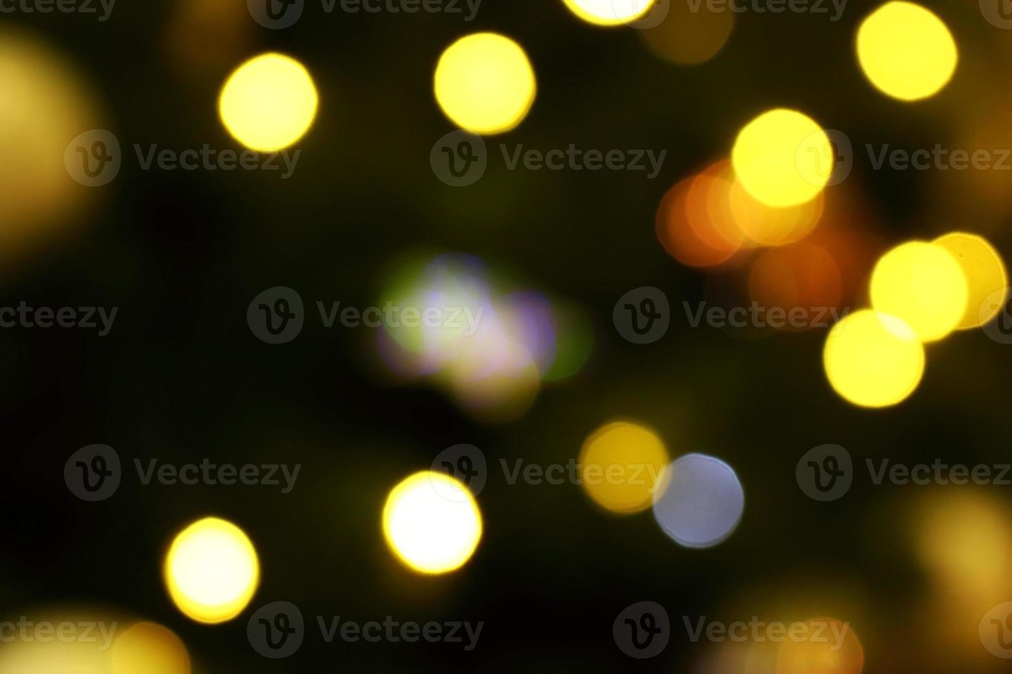 Long exposure blurred yellow and blue christmas tree lights abstract background photo