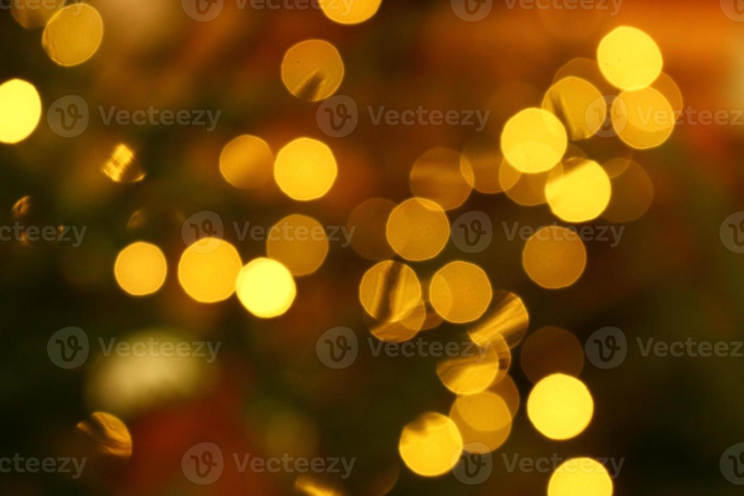 Long exposure blurred yellow christmas tree lights abstract background photo