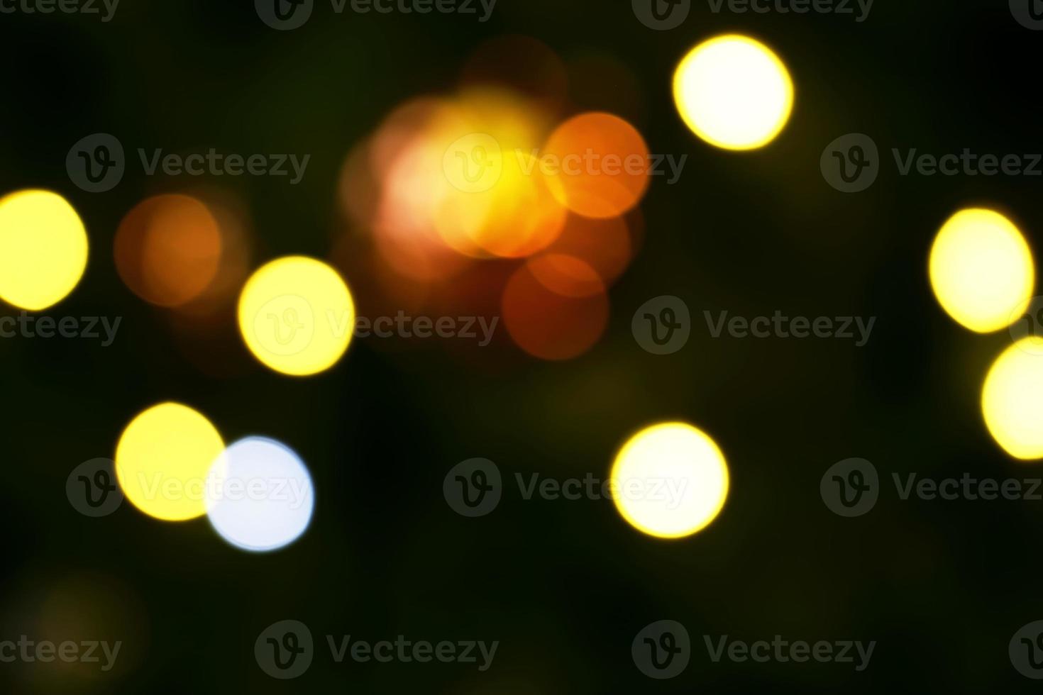 Long exposure blurred yellow and white christmas tree lights abstract background photo