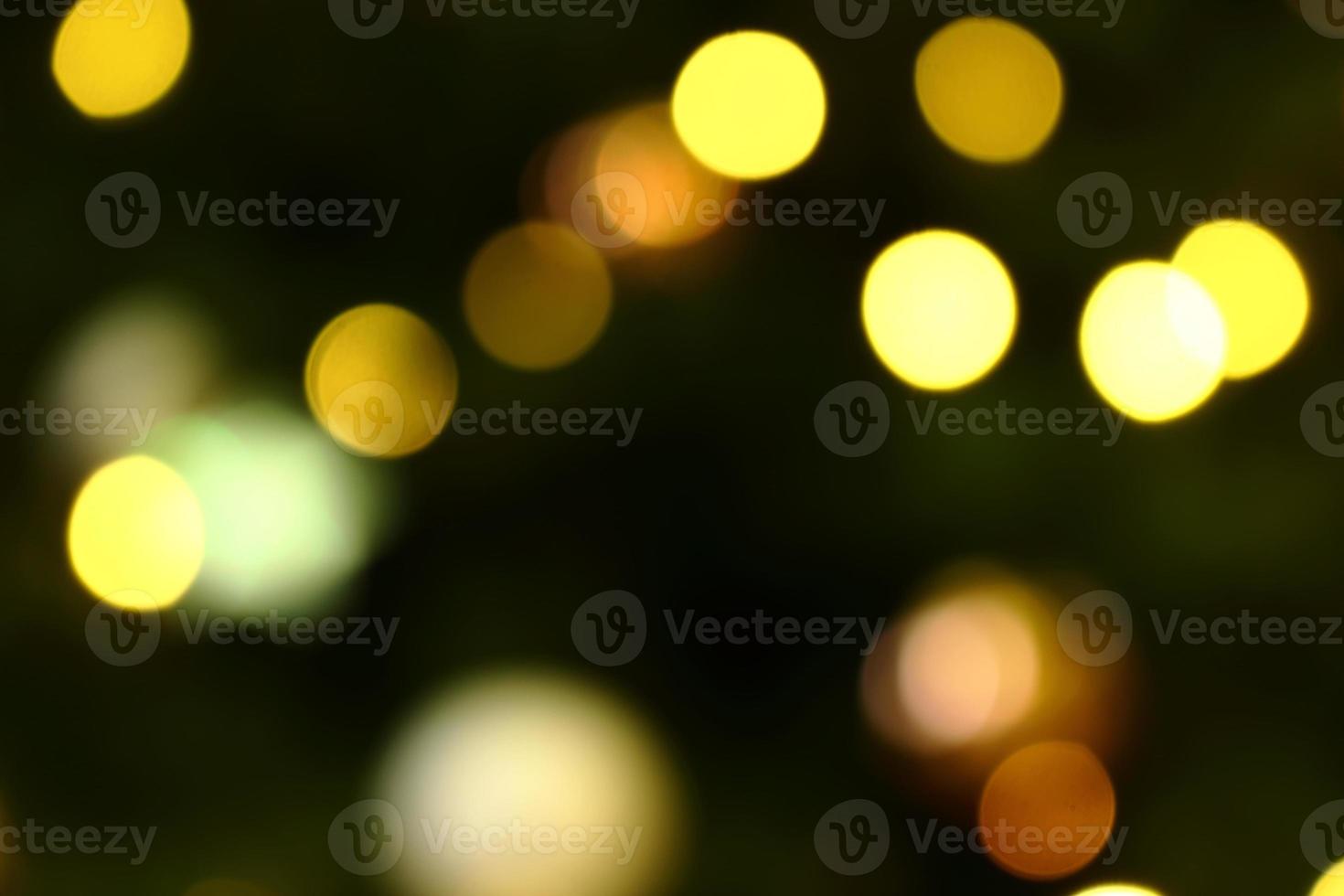 Long exposure blurred yellow and white christmas tree lights abstract background photo