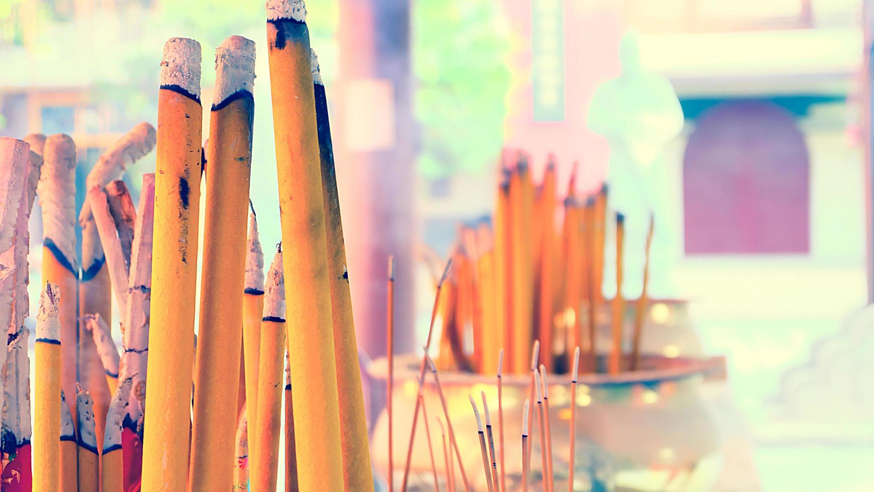 Smoking Incense Sticks at a Temple in Hong Kong. Horizontal shot photo