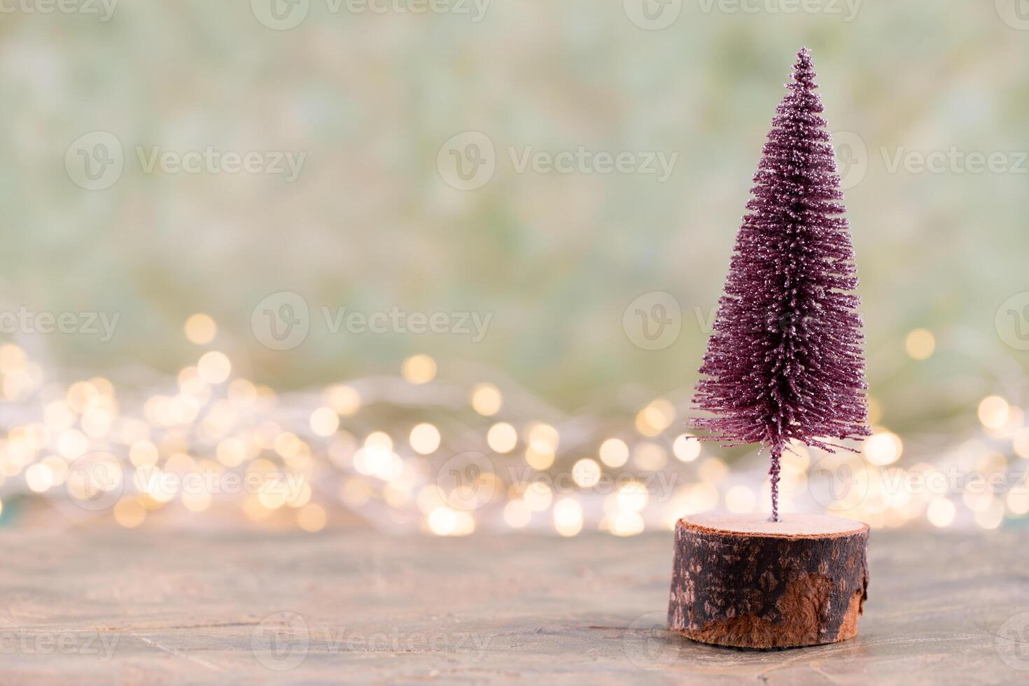 Colorful Christmas tree on green, bokeh background. photo