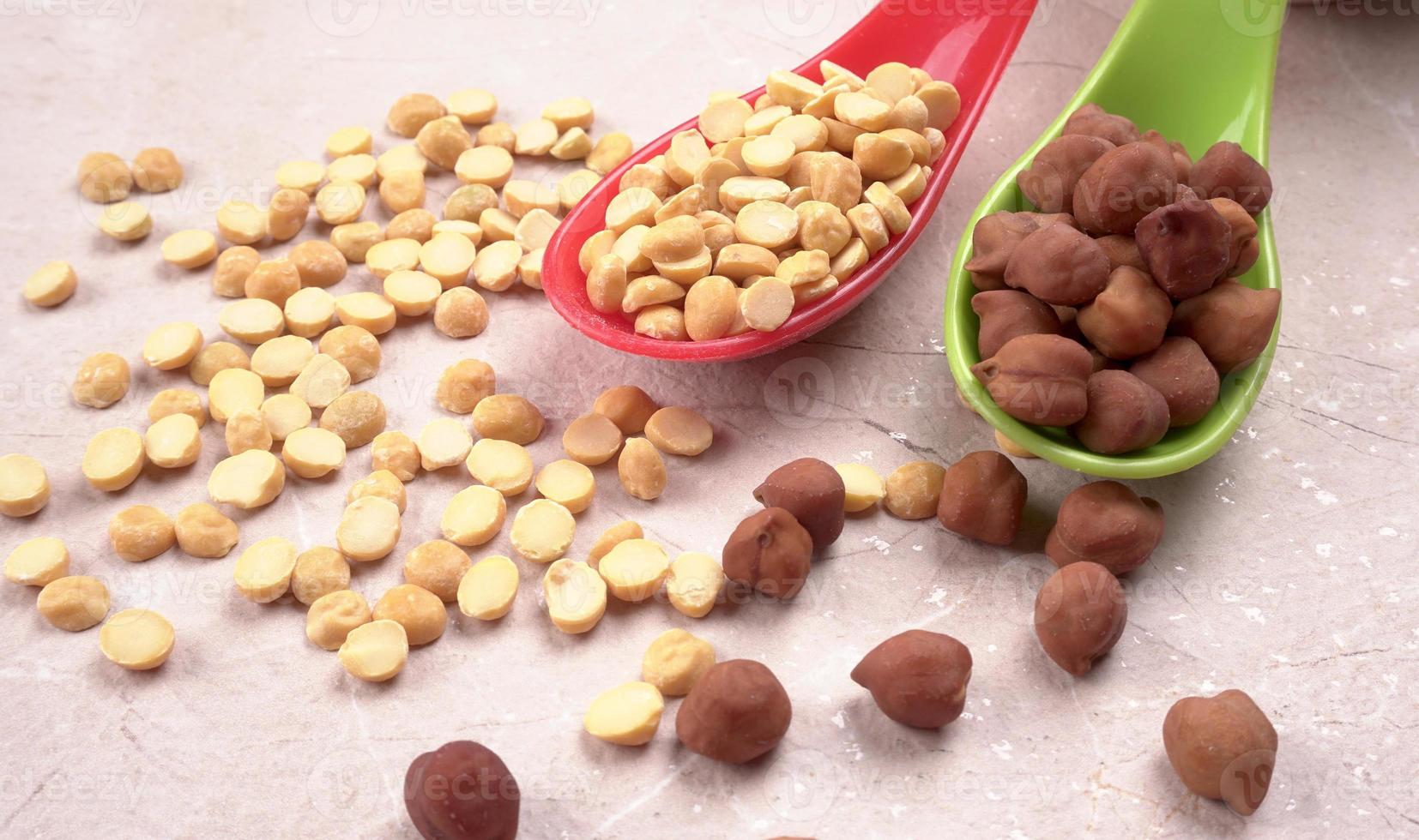 Black Chickpeas or Kala Chana with chana dal pulse isolated on wooden Background. photo