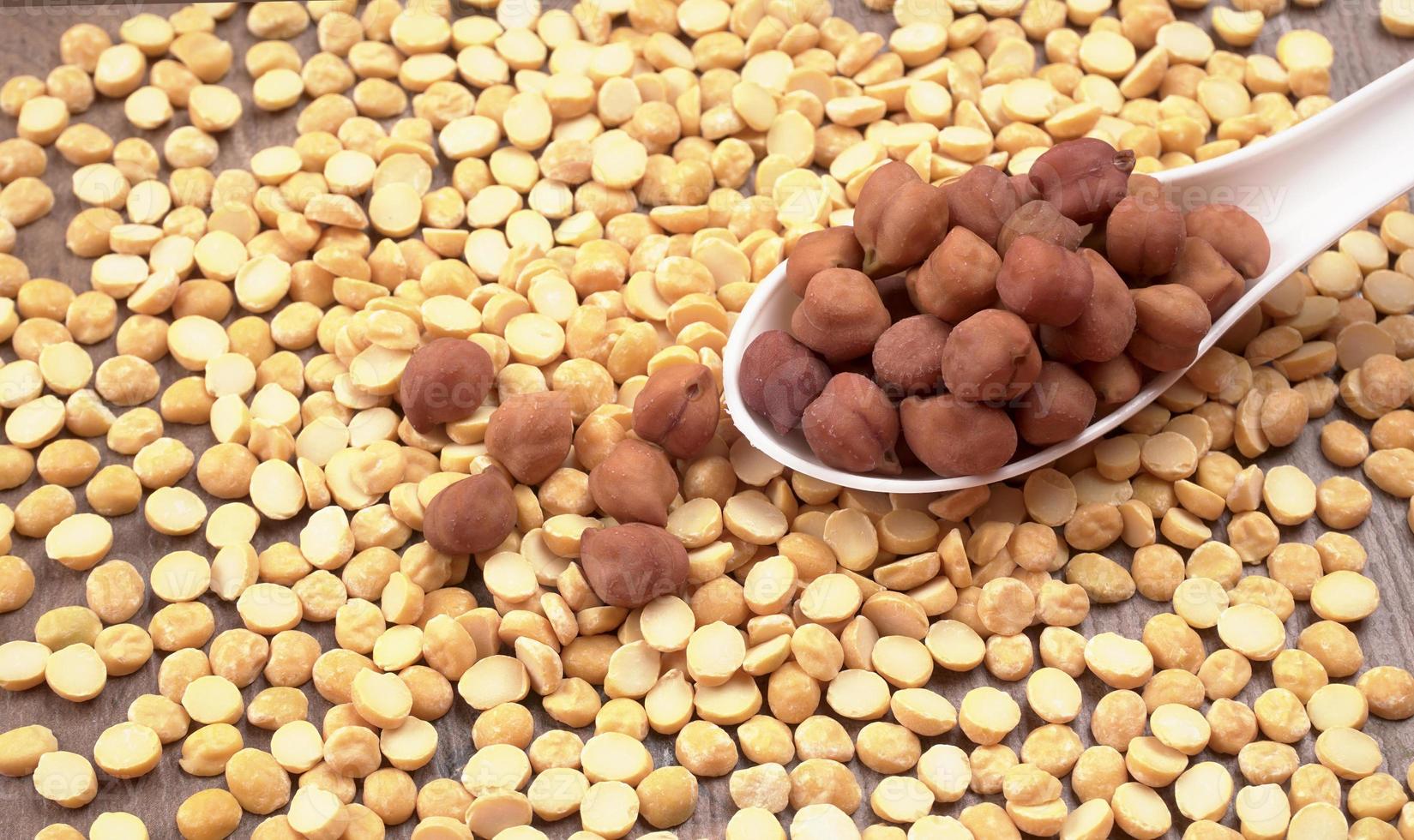 Black Chickpeas or Kala Chana with chana dal pulse isolated on wooden Background. photo