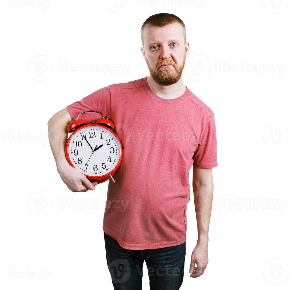 Unhappy man with an alarm clock photo