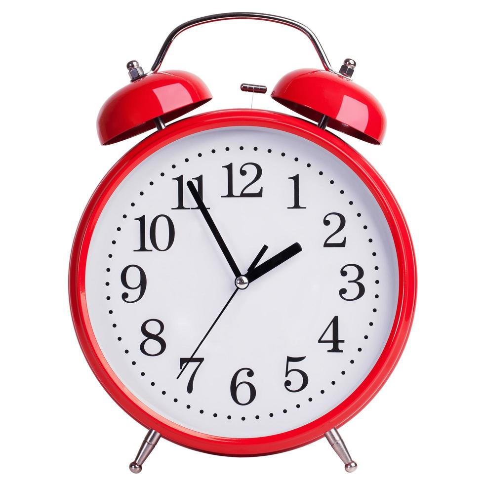 Alarm clock shows five minutes to two photo