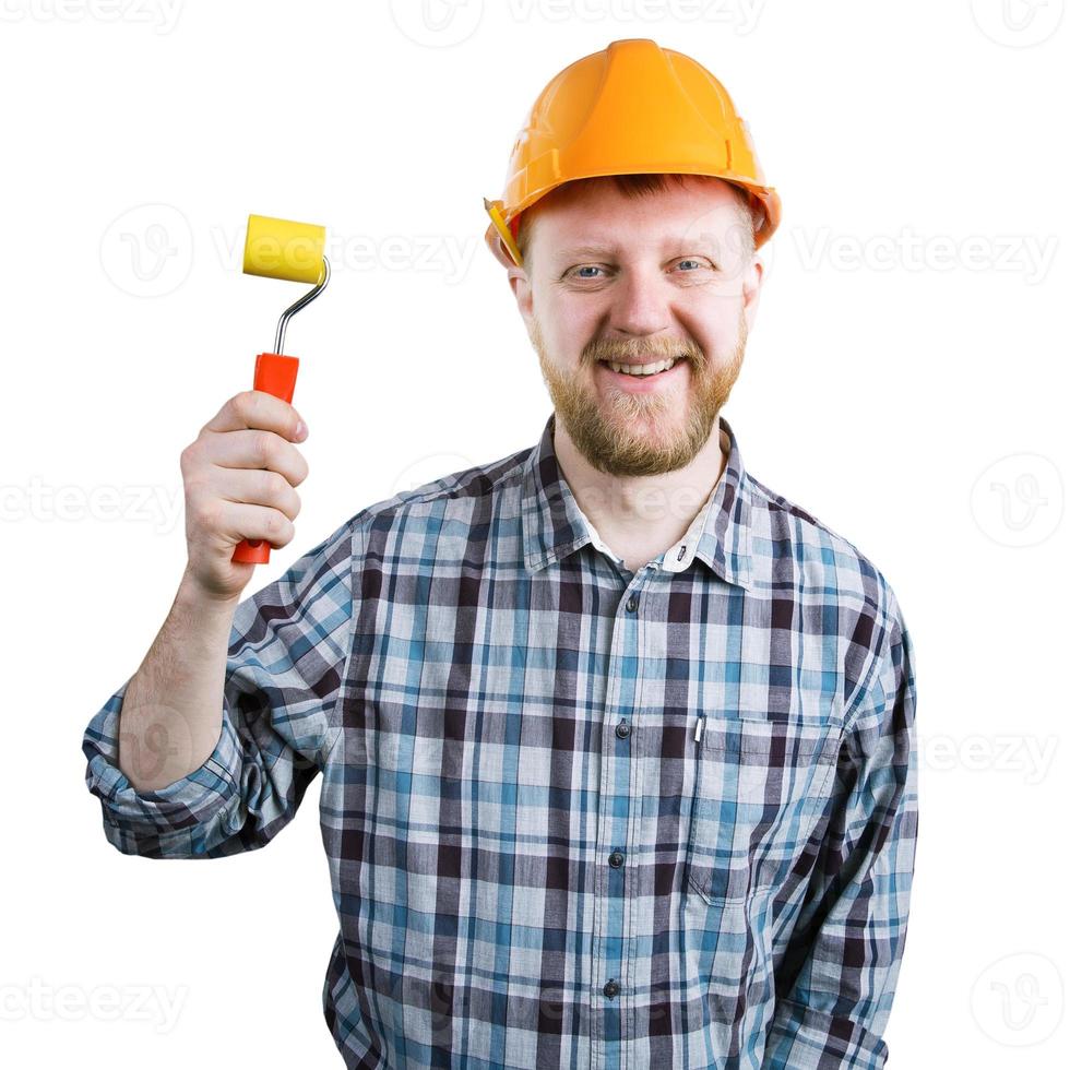 Man in a helmet with a paint roller photo
