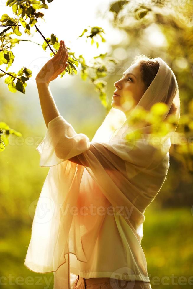 Happy woman in a summer garden photo