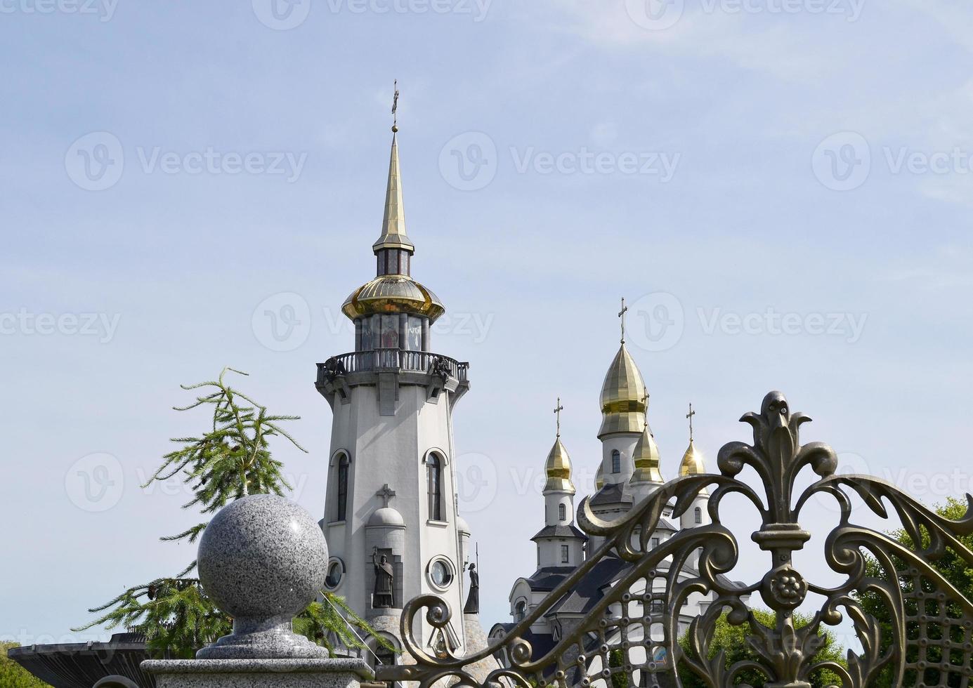 Christian church cross in high steeple tower for prayer photo