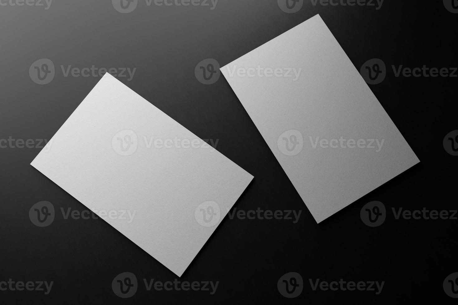 White vertical business card paper mockup template with blank space cover for insert company logo or personal identity on black cardboard floor background. Modern concept. 3D illustration render photo