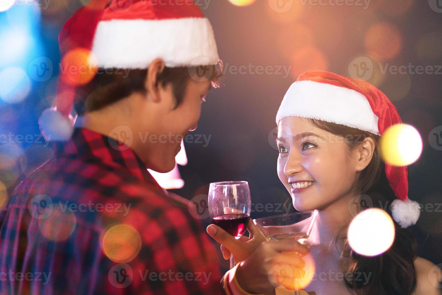Asian lovers eye contact looking and smiling to each other in pub. Honeymoon and Holiday concept photo