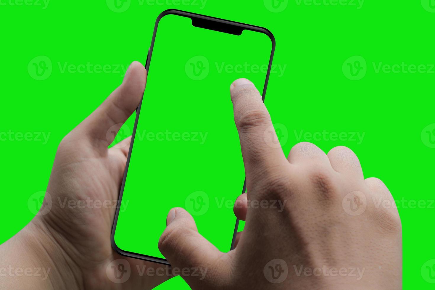 moderno teléfono inteligente en la mano. pantalla verde y fondo foto