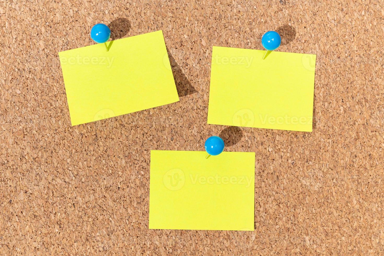 Group of Yellow sticky notes on a cork board for adding text. Template