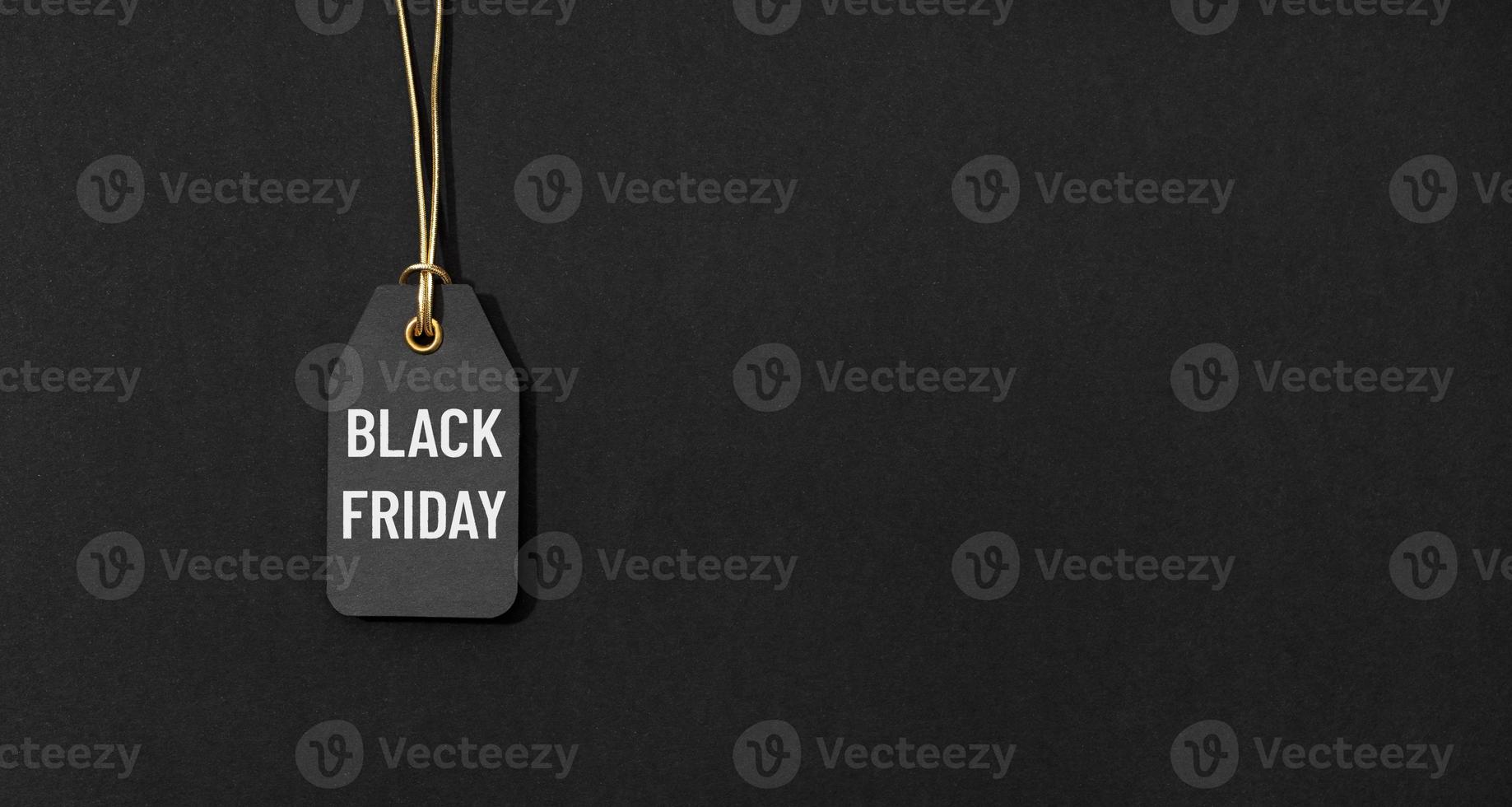 Black friday tag isolated on black background with copy space photo