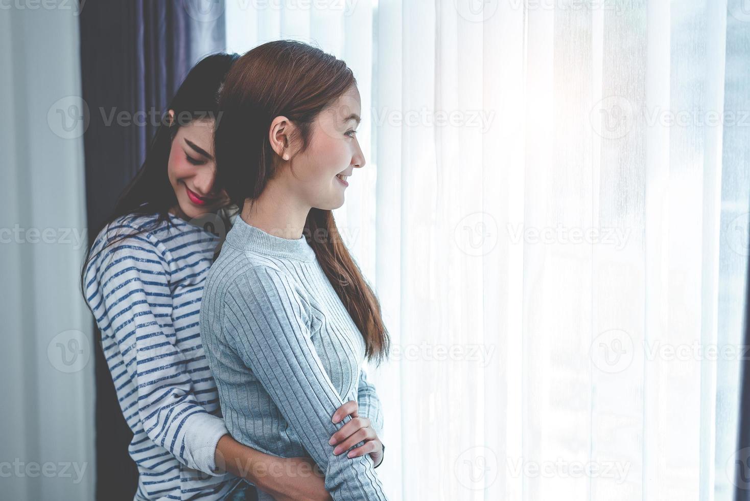 Two Asian Lesbian women hug and embracing together in bedroom.Beauty concept. Happy lifestyles theme. Homosexual life theme. Love scene making of female photo