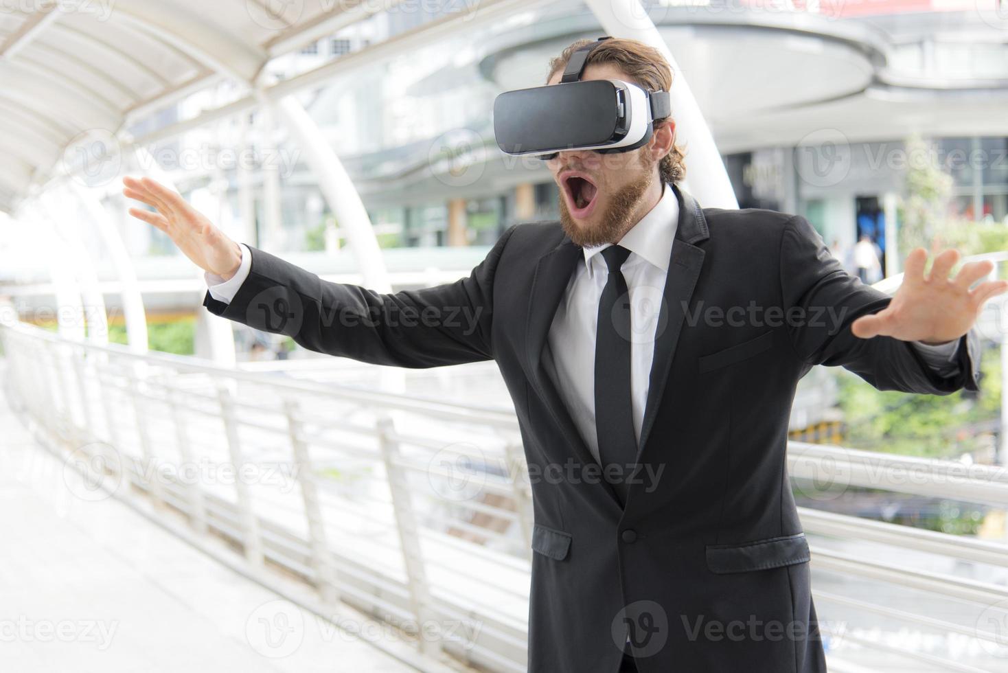 Businessman wearing virtual reality goggle glasses and enjoying in this activity, future technology concept, imagine concept photo