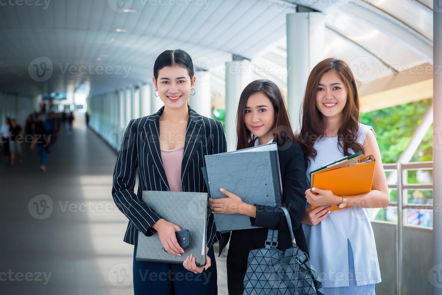 Business women standing and holding files, Business concept, Beauty Concept photo