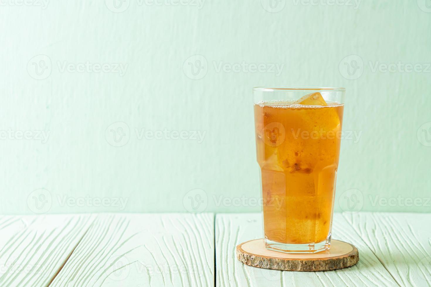 Delicious sweet drink tamarind juice and ice cube photo