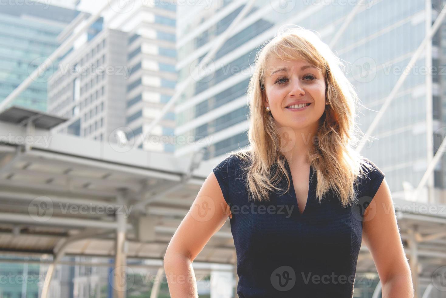 Beauty woman portrait with city and building background. Happy life of people concept. Smiling lady theme photo