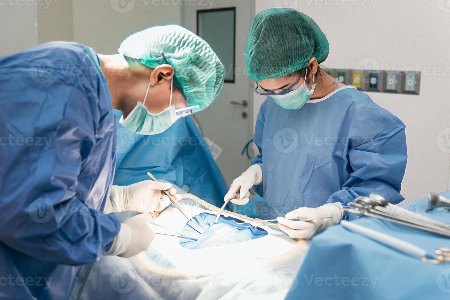 Doctor and assistant nurse operating for rescue patient from dangerous emergency case. Hospital and Surgery Concept. Health care and Medical concept. Cancer and disease treatment photo