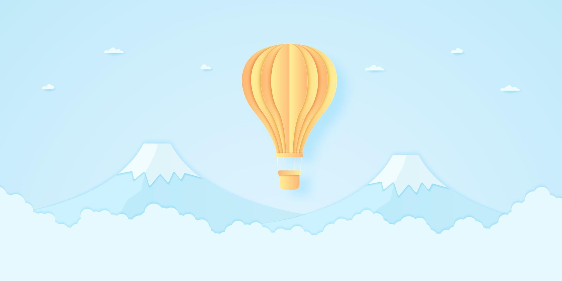 bright hot air balloon flying over mountain with blue sky, paper art style vector