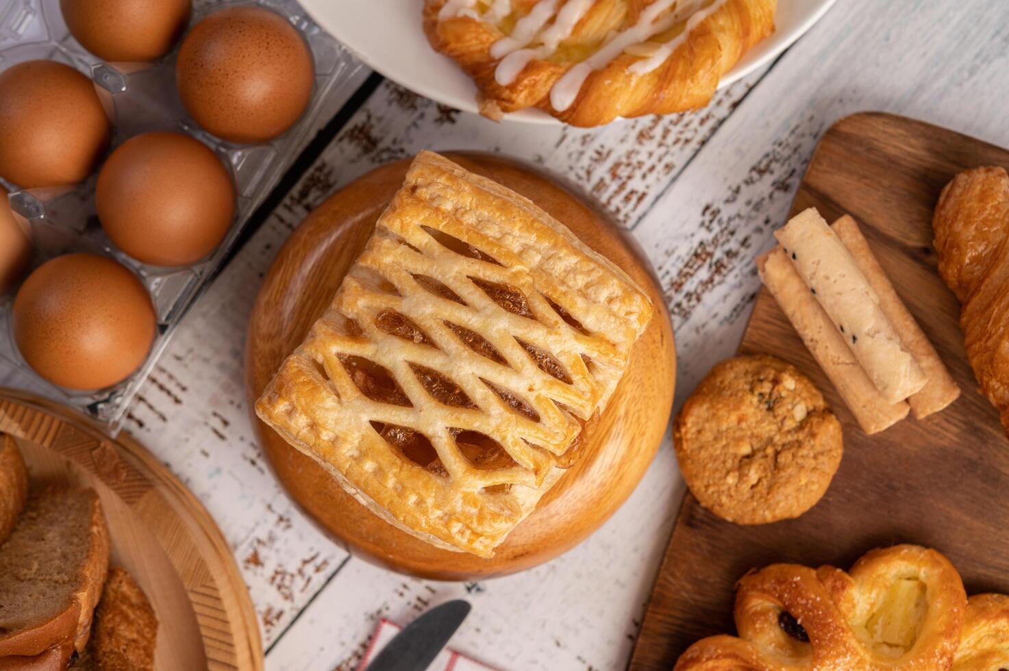 Various breads and eggs on red white cloth. Selective focus. photo